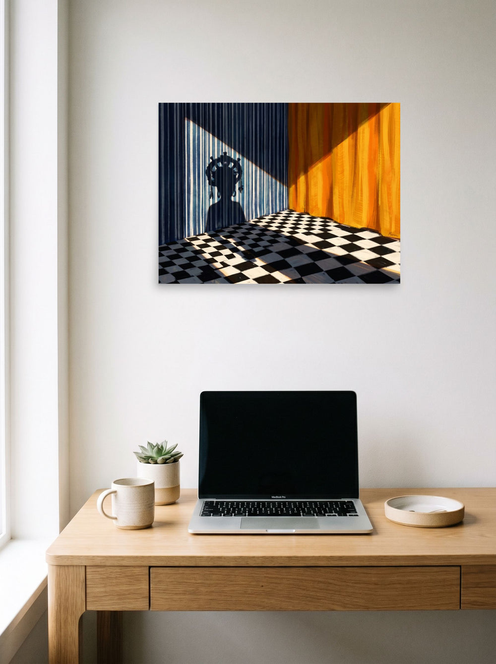 A 24x18 inch unframed paper Surrealism,Magic realism print of 'Crowned Silhouette' hanging above a worktable with a laptop.