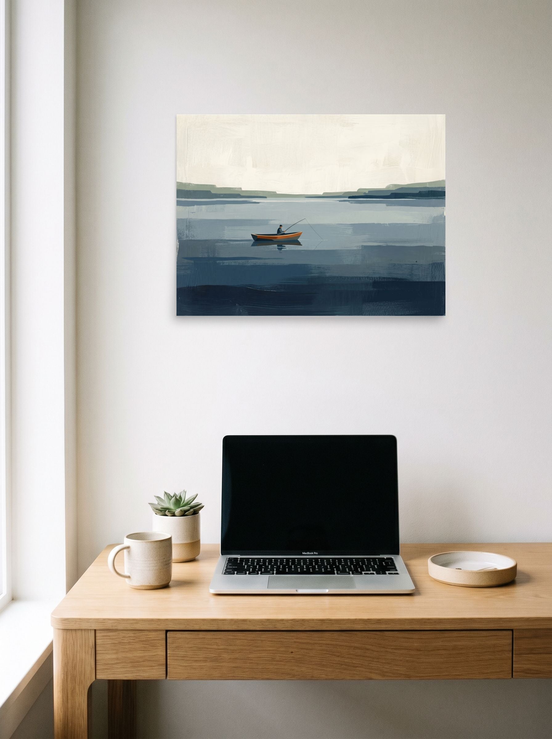 A 24x18 inch unframed paper Minimalism print of 'Quiet Waters' hanging above a worktable with a laptop.