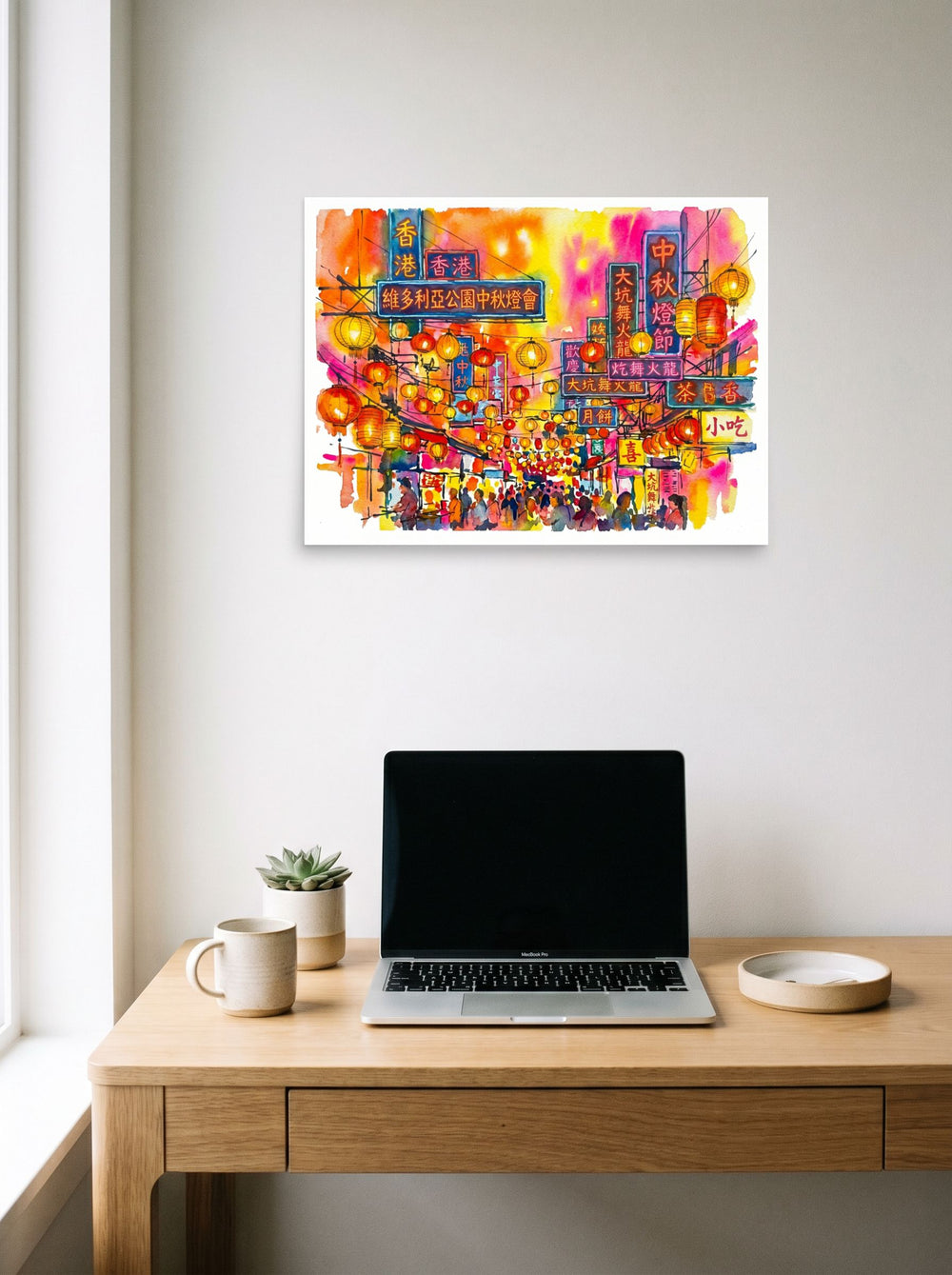 A 24x18 inch unframed paper Fauvism print of 'Lantern Festival Glow' hanging above a worktable with a laptop.