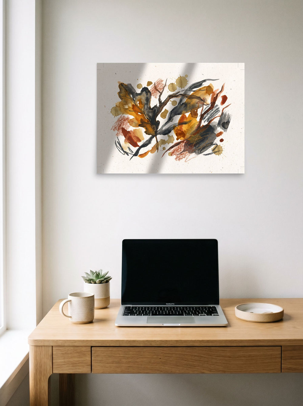 Dau-al-Set wall art 'Autumnal Reverie', unframed paper at 24x18 inch, hanging above a worktable with a laptop.