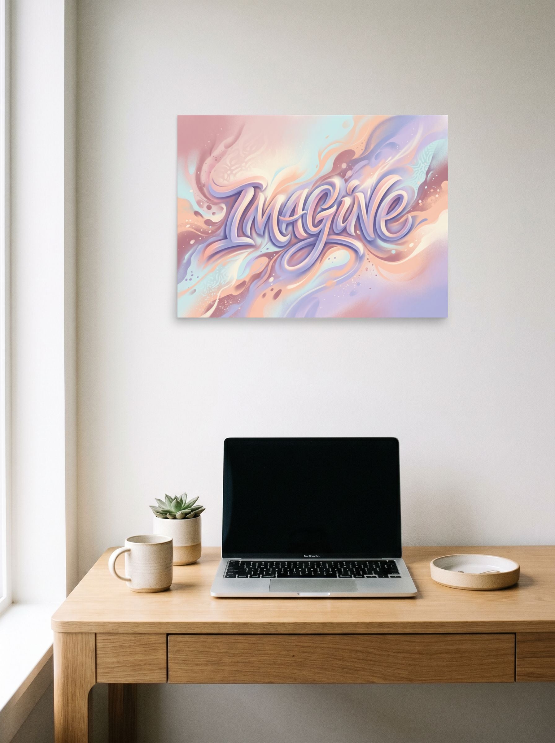 A 24x18 inch unframed paper Pop art,Abstract art print of 'Dreamer's Imagine' hanging above a worktable with a laptop.