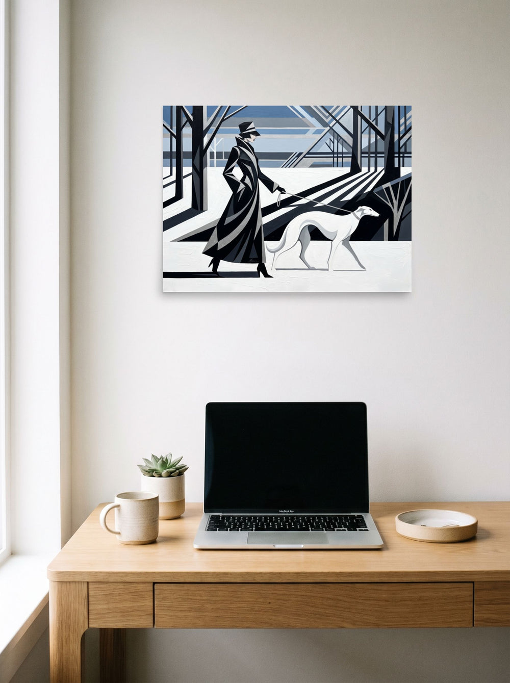 A 24x18 inch unframed paper Art Deco print of 'Winter Stroll' hanging above a worktable with a laptop.