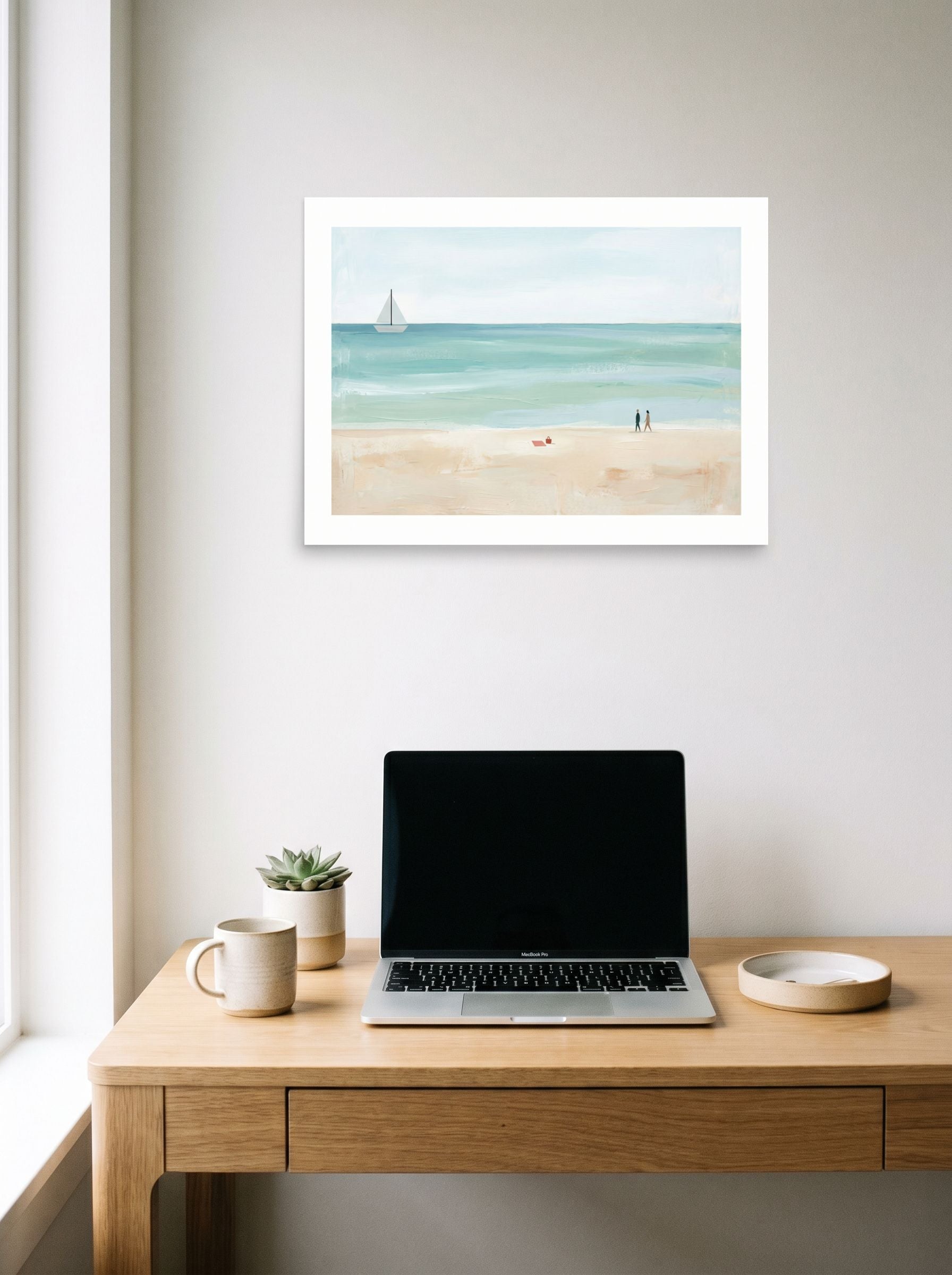 A 24x18 inch unframed paper Minimalism,Impressionism print of 'Coastal Stroll' hanging above a worktable with a laptop.