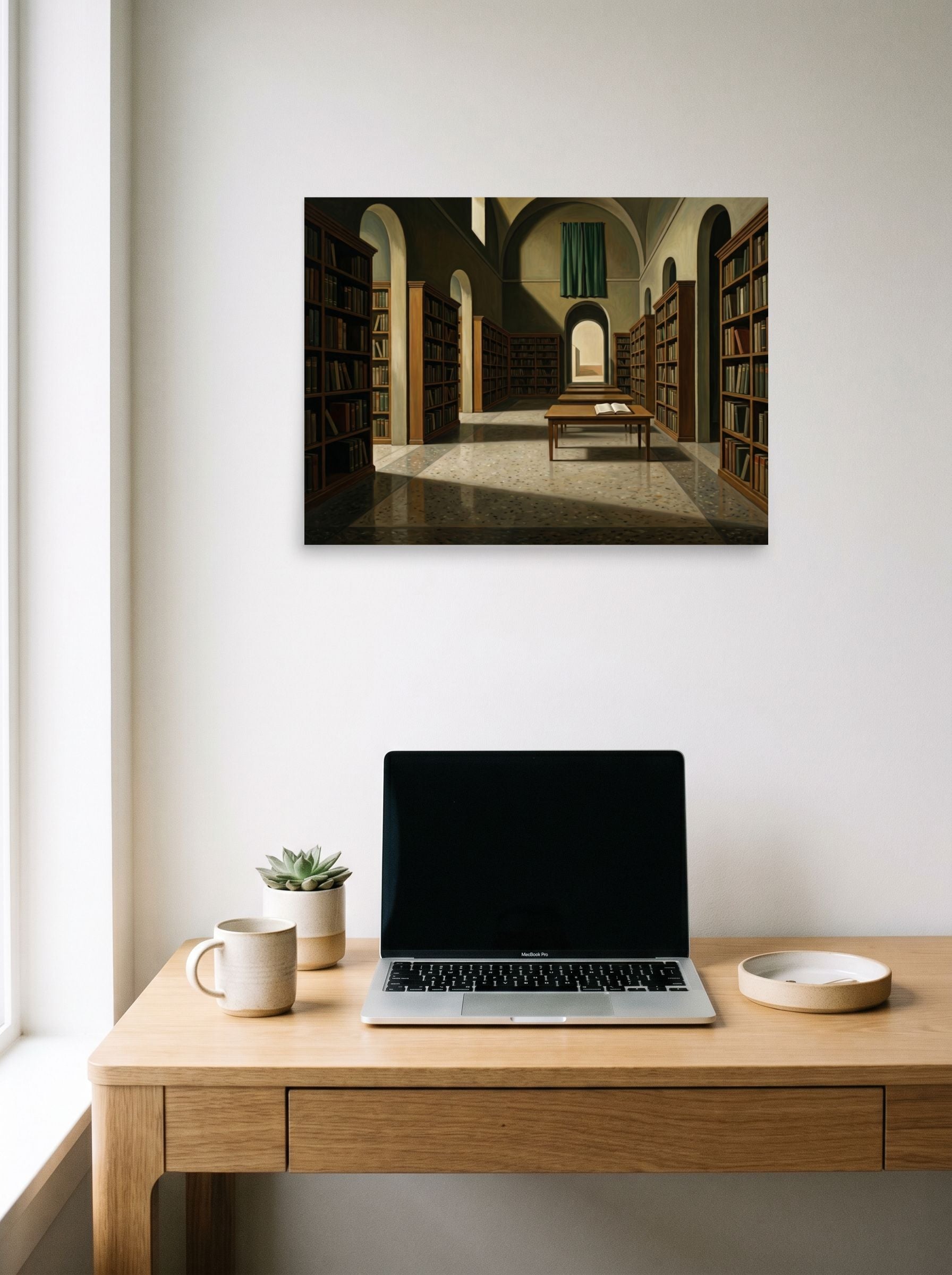 A 24x18 inch unframed paper Metaphysical painting print of 'The Silent Archive' hanging above a worktable with a laptop.