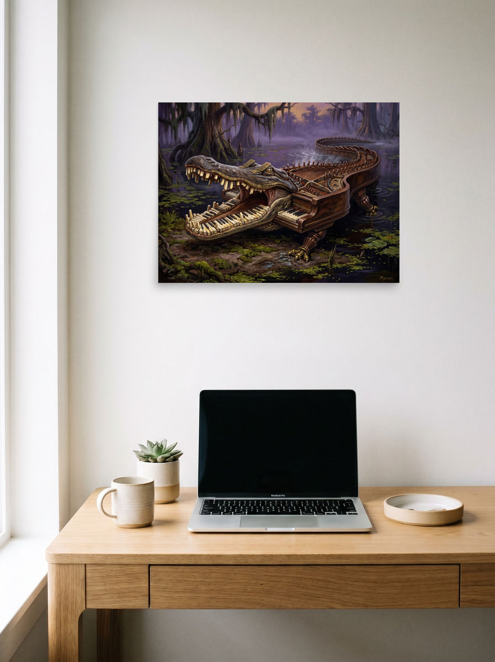 A unframed paper print of the Surrealism artwork 'The Bayou Pianoforte', displayed over a compact desk setup.