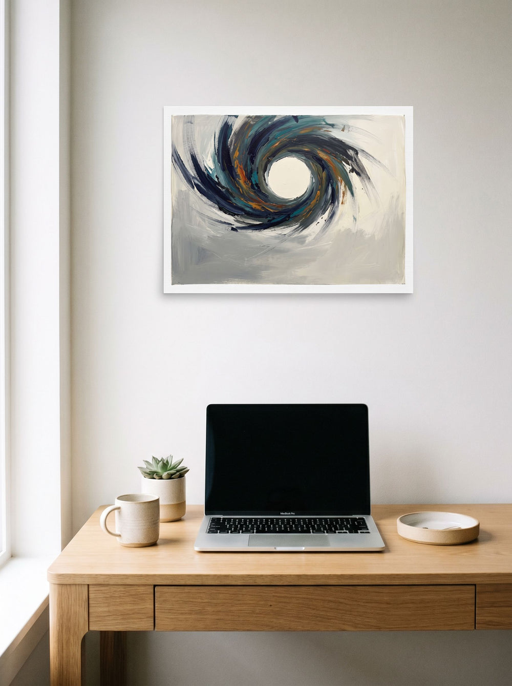 Mockup of 'The Primordial Void' as a 24x18 inch unframed paper print, hanging above a worktable with a laptop.