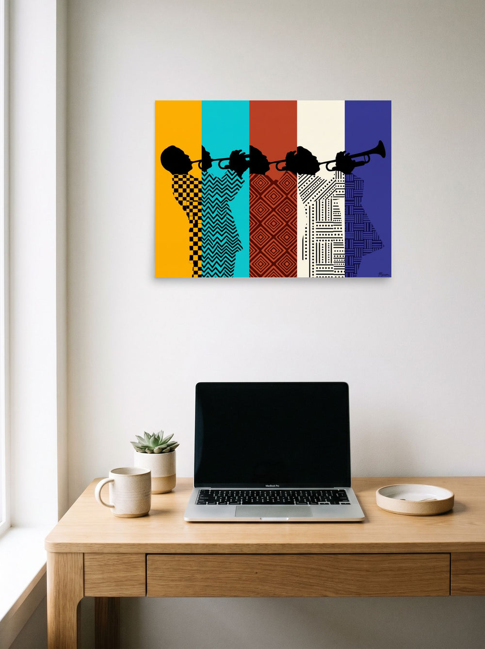 A 24x18 inch unframed paper Harlem Renaissance,Pop art print of 'Polyphonic Rhythm' hanging above a worktable with a laptop.