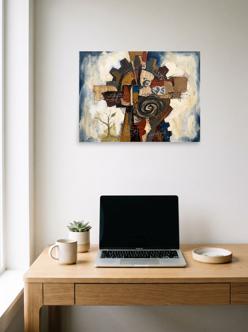 Dau-al-Set wall art 'The Cogwheel Assemblage', unframed paper at 24x18 inch, hanging above a worktable with a laptop.