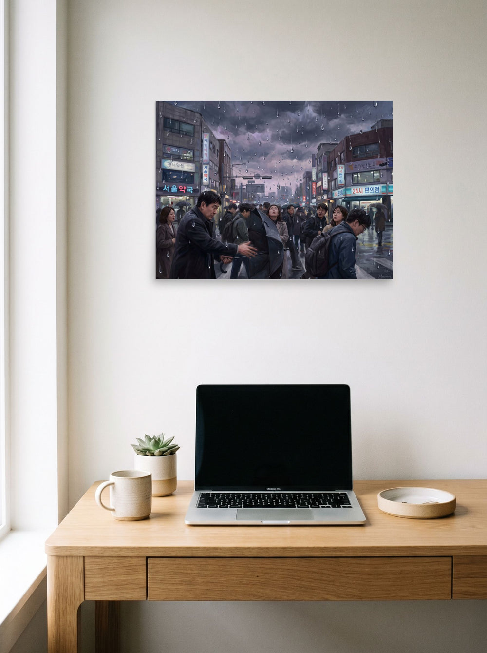 A unframed paper print of the Realism artwork 'Sudden Downpour in Seoul', styled above a home-office workspace.