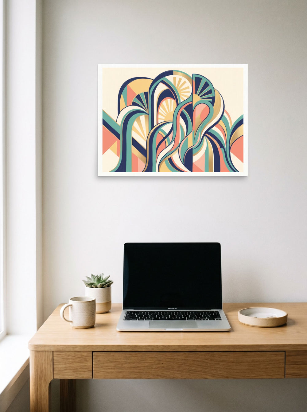 A 24x18 inch unframed paper Art Deco print of 'Dynamic Deco Arches' hanging above a worktable with a laptop.