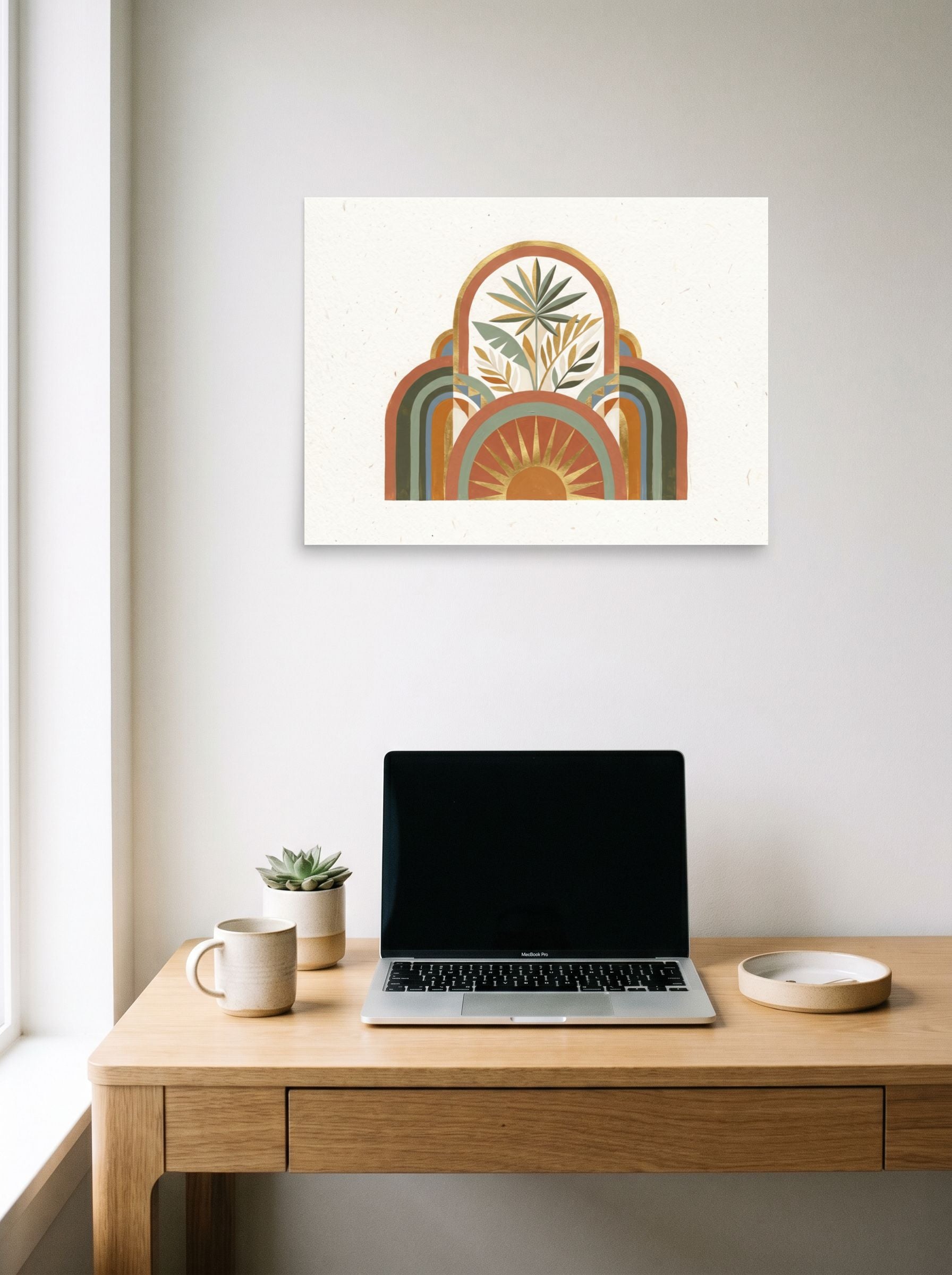 A 24x18 inch unframed paper Minimalism,Geometric abstract art print of 'Golden Archway Oasis' hanging above a worktable with a laptop.