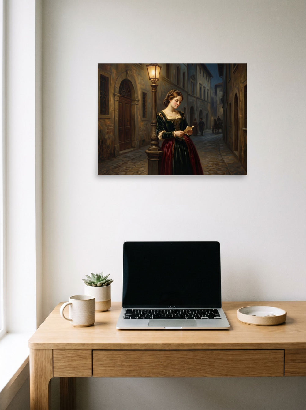 The Renaissance print 'Letters by Lamplight', 24x18 inch unframed paper, hanging above a worktable with a laptop.