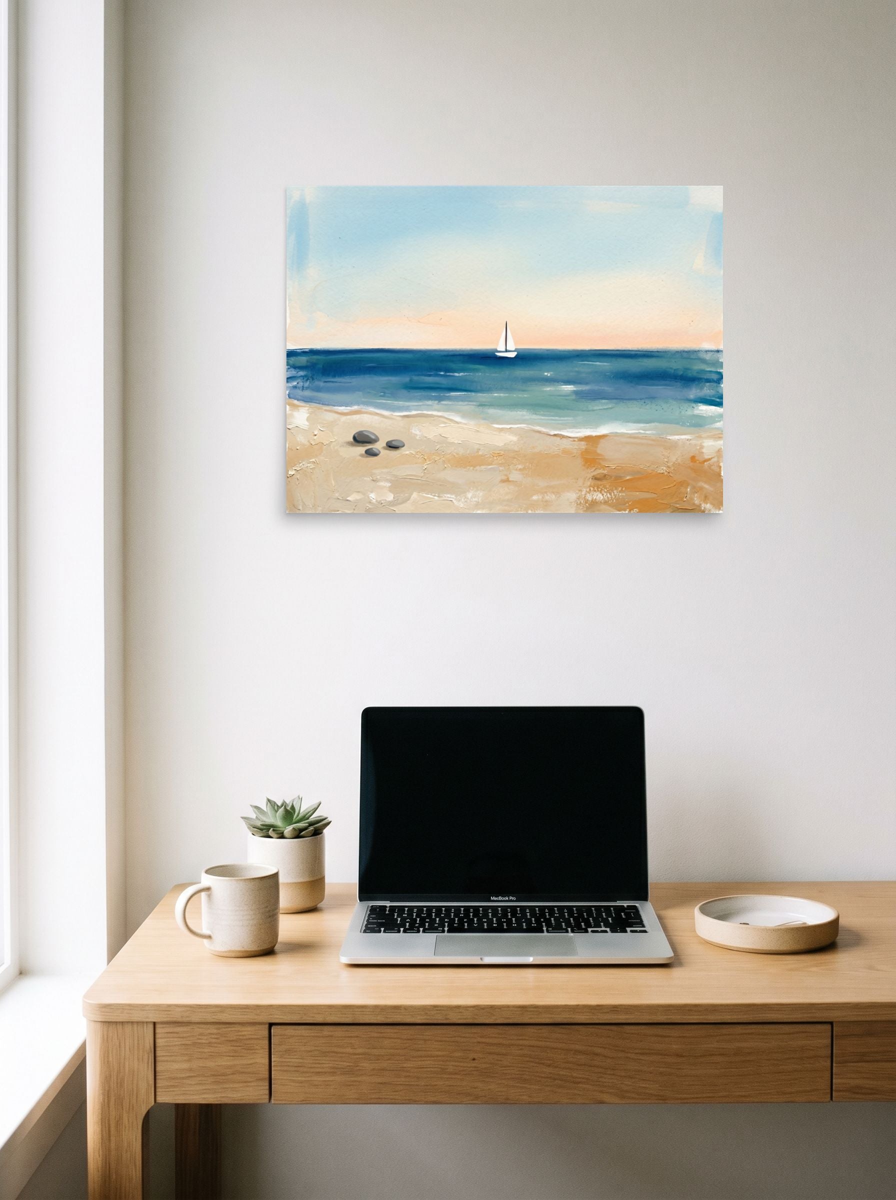 A 24x18 inch unframed paper Impressionism,Minimalism print of 'Distant Sails' hanging above a worktable with a laptop.