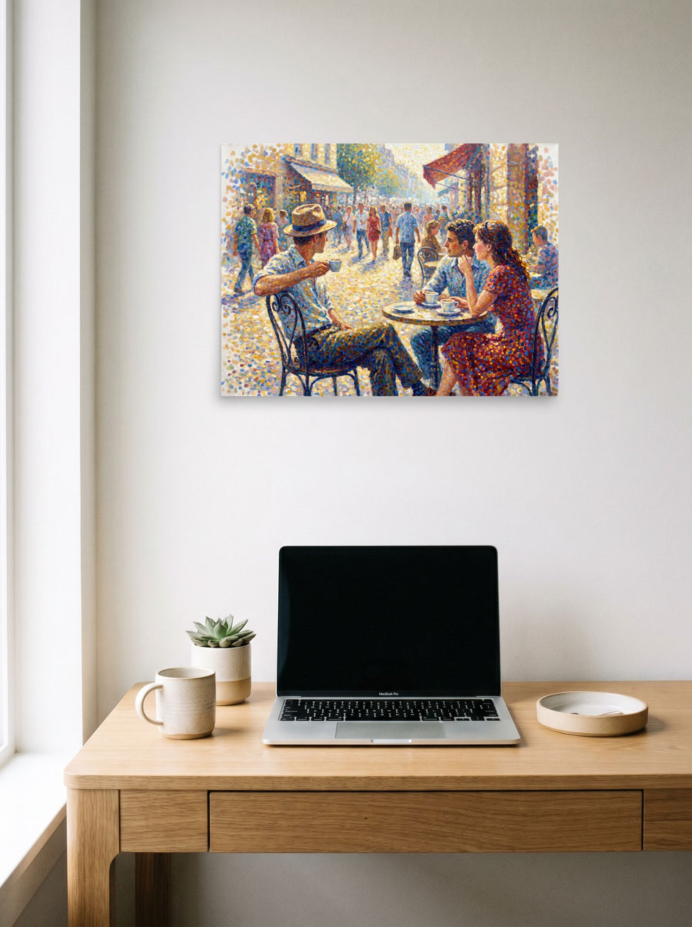 The Pointillism print 'Midday at the Bistro', 24x18 inch unframed paper, displayed over a compact desk setup.