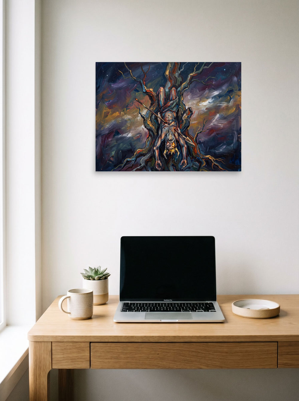 The Expressionism print 'The Hanged God', 24x18 inch unframed paper, styled above a home-office workspace.