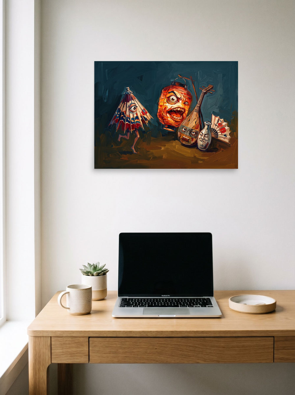 'Night of the Tsukumogami', a Japanese art print styled above a home-office workspace. Shown as unframed paper, 24x18 inch.