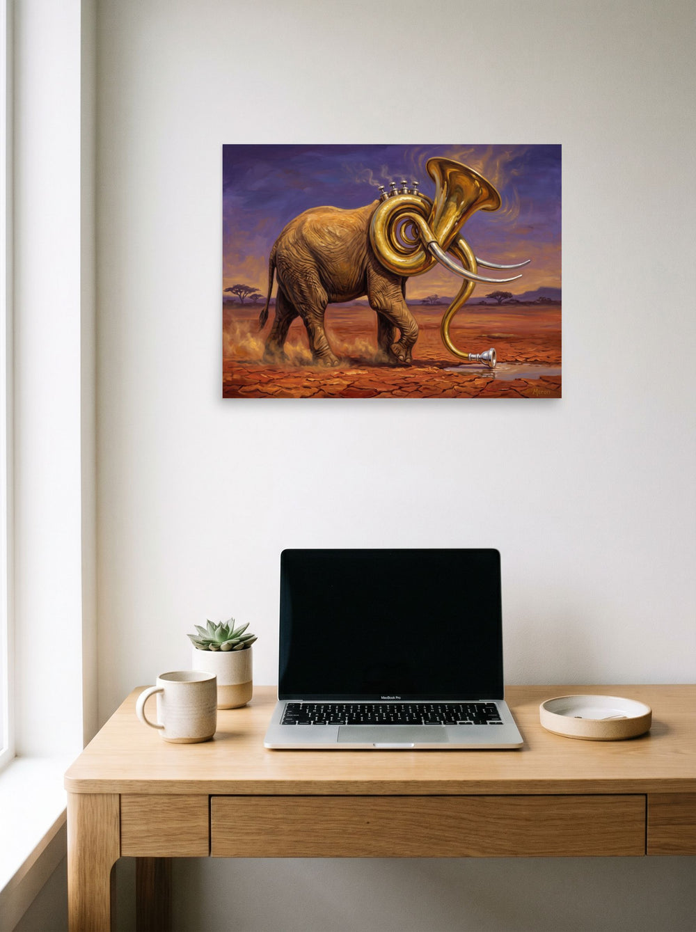 'The Savanna Sousaphone' hanging above a worktable with a laptop. A 24x18 inch unframed paper Surrealism print.