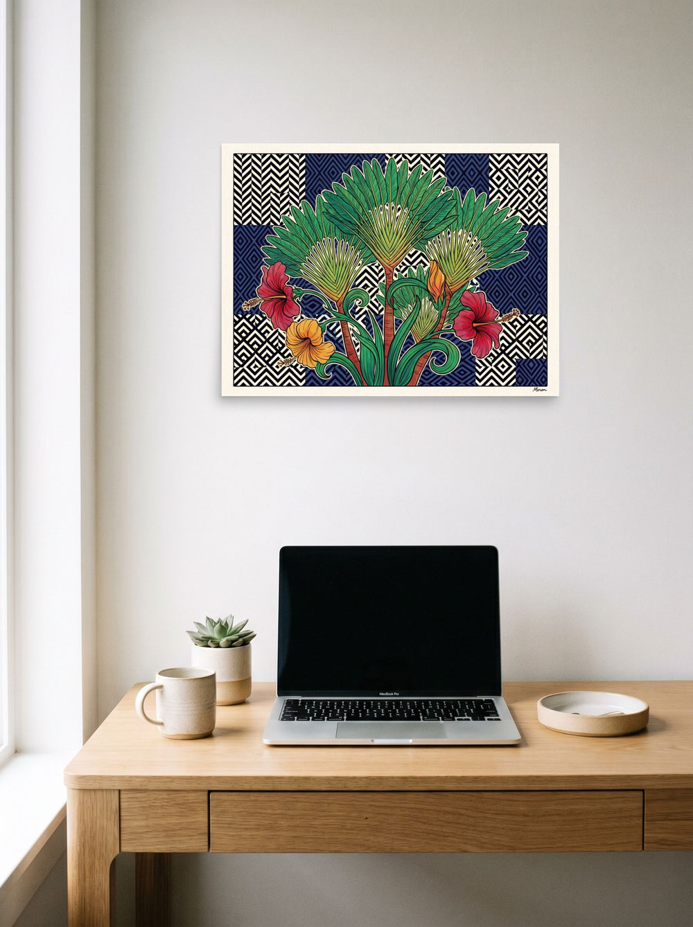 A 24x18 inch unframed paper Art Deco,Art Nouveau print of 'Tropical Tessellation' hanging above a worktable with a laptop.