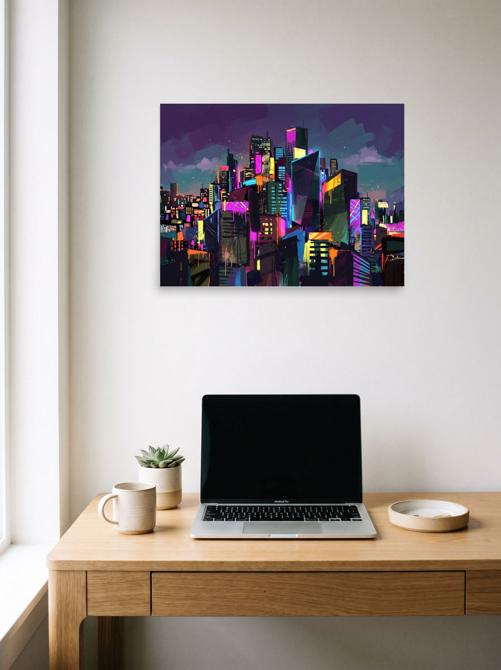 A 24x18 inch unframed paper version of 'Neon Metropolis', Neo-expressionism wall art, hanging above a worktable with a laptop.