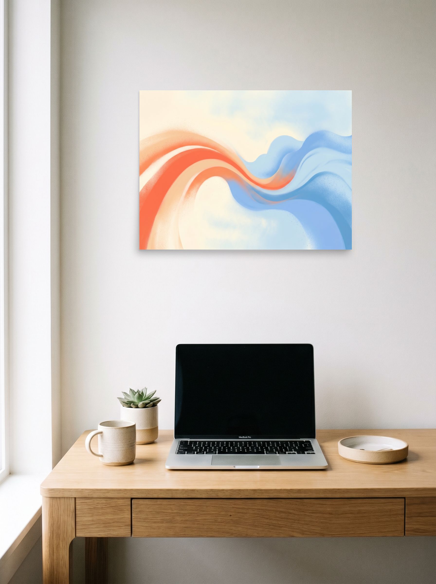 A 24x18 inch unframed paper Abstract art print of 'Soft Serenade' hanging above a worktable with a laptop.
