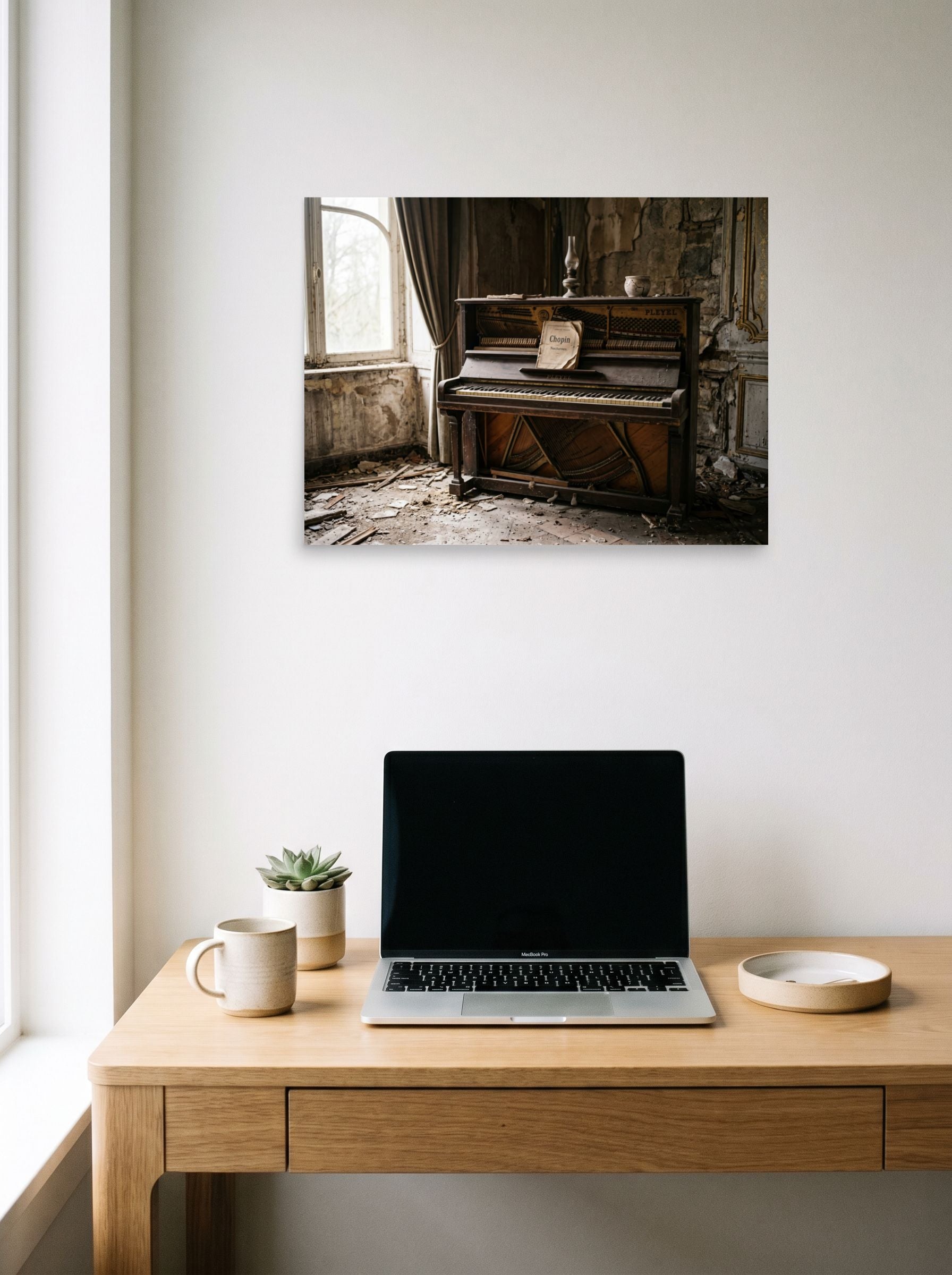 A 24x18 inch unframed paper Art photography print of 'The Forgotten Melody' hanging above a worktable with a laptop.