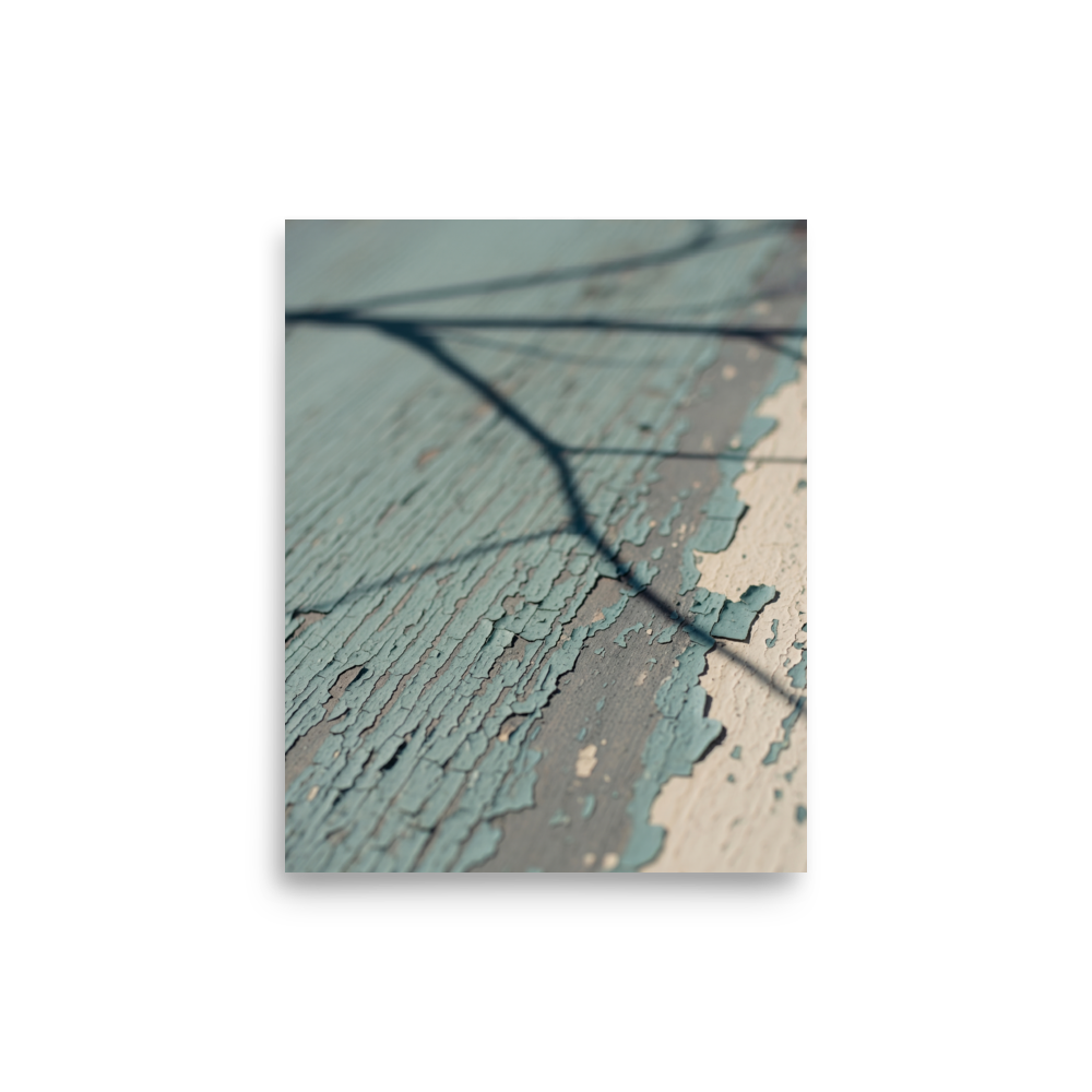 'Fading Blue' — a Art photography print. A close-up photograph of peeling light blue paint on weathered wood with a sharp shadow of a tree branch, suitable for a cozy Sunroom or Bedroom.