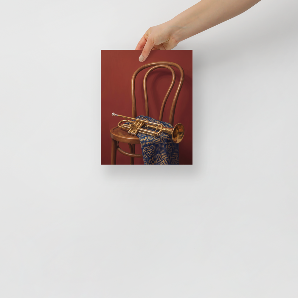 'Brass and Indigo' — a Realism,Modernism print. An oil painting still life featuring a golden trumpet on a wooden chair draped with a blue and gold geometric textile against a deep red wall, perfect for a music room or lounge.