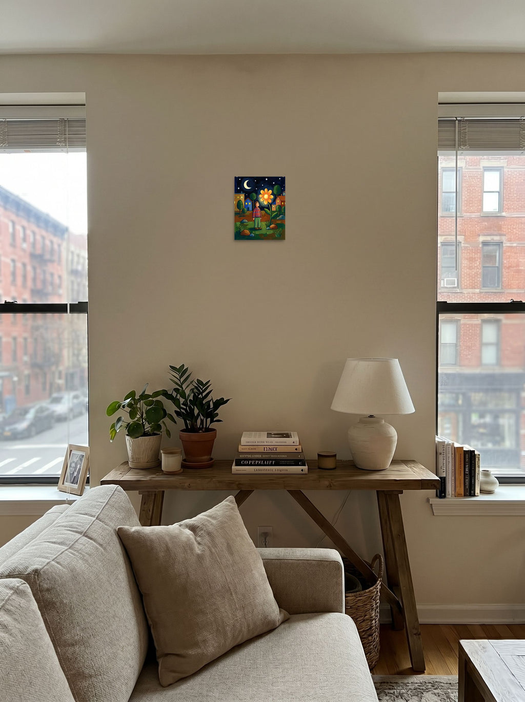 A 8x10 inch unframed paper Naive art print of 'The Glowing Night Bloom' displayed in the center of a living room.