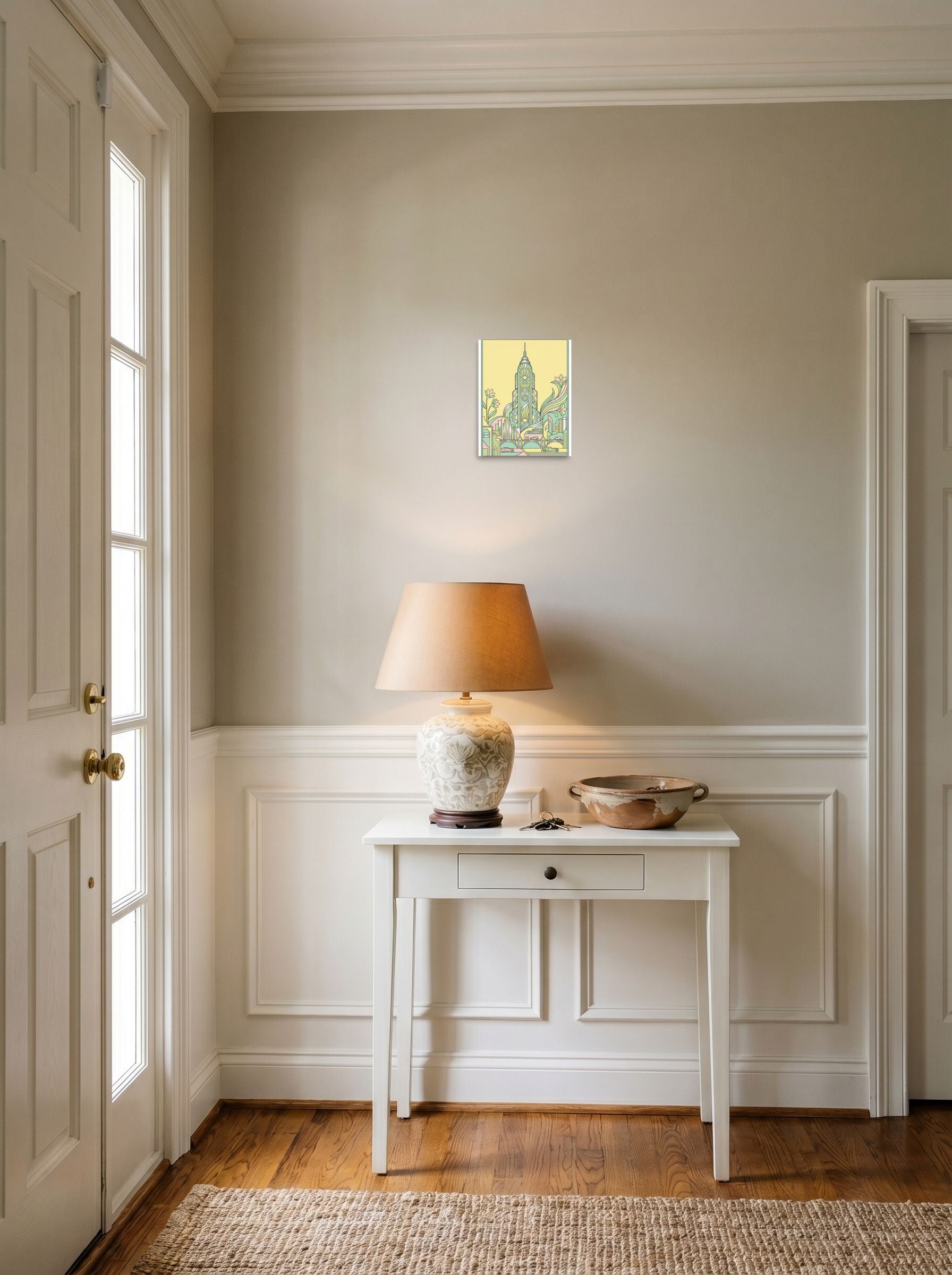 A 8x10 inch unframed paper Art Deco print of 'The Emerald Spire' hanging in an entryway near a console.