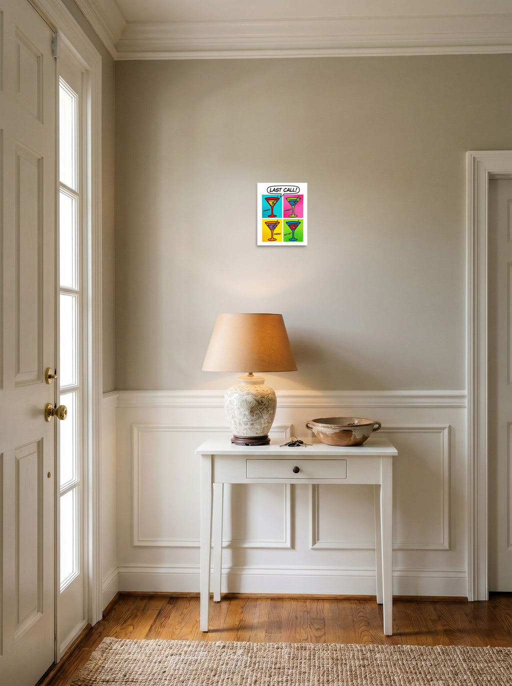 A 8x10 inch unframed paper Pop art print of 'Last Call' hanging in an entryway near a console.