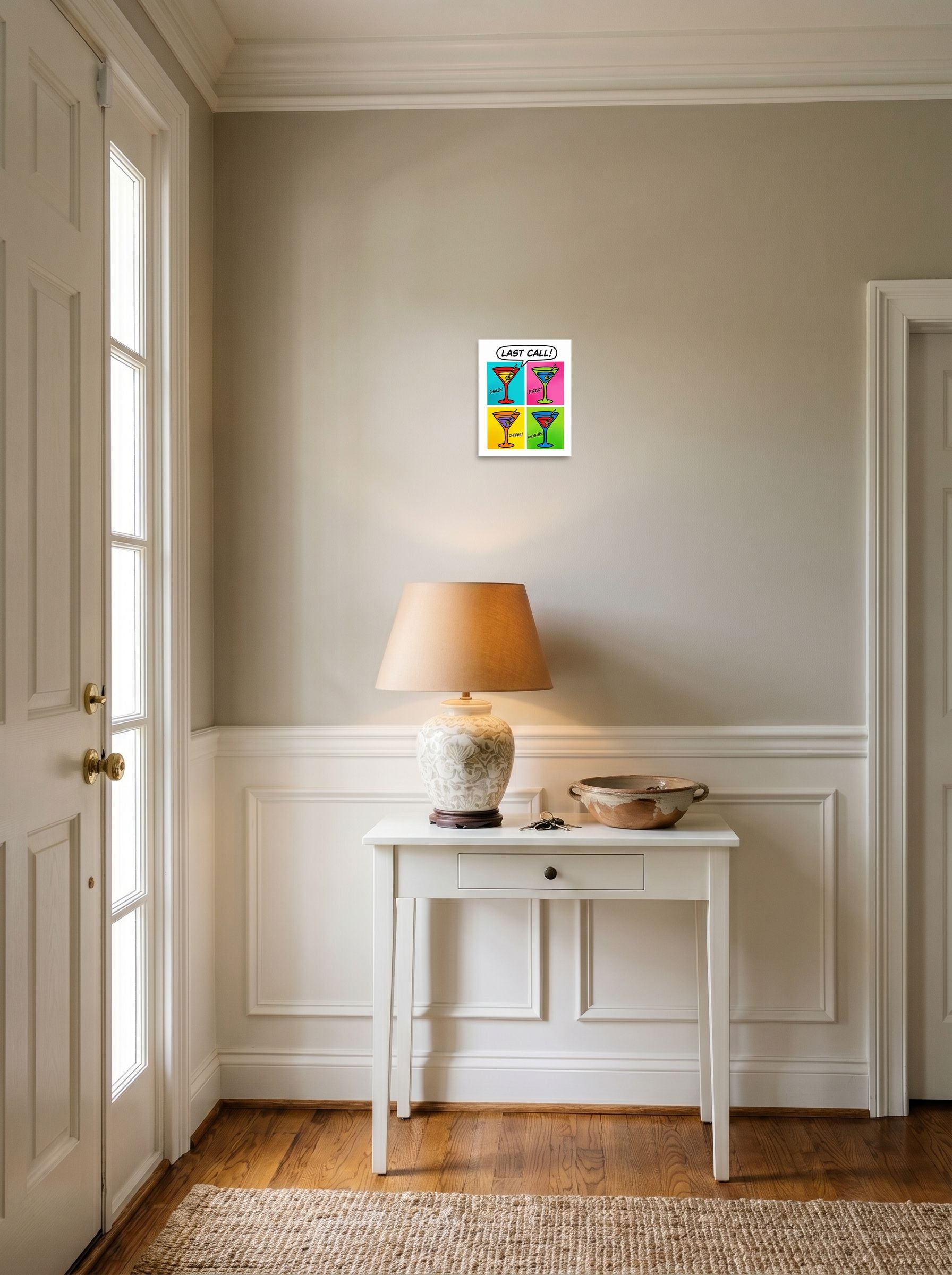 A 8x10 inch unframed paper Pop art print of 'Last Call' hanging in an entryway near a console.