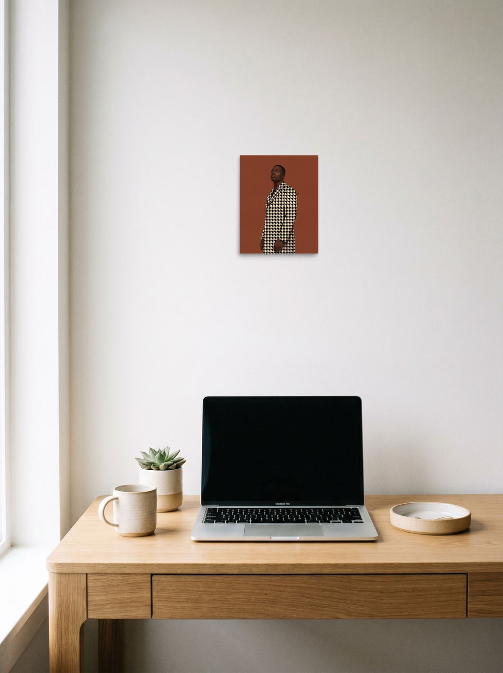 A 8x10 inch unframed paper Figurative art,Realism print of 'Houndstooth Elegance' hanging above a worktable with a laptop.