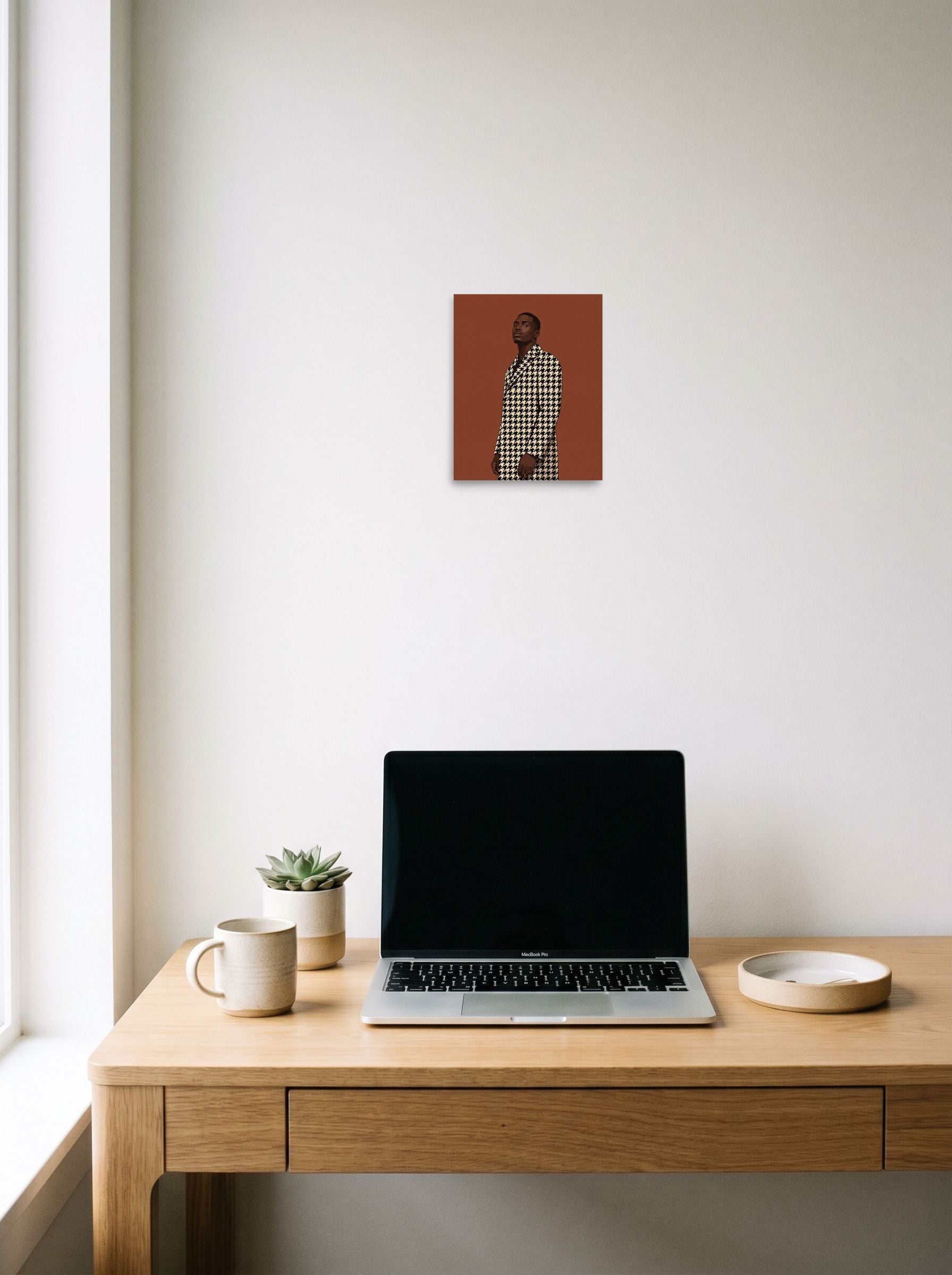 A 8x10 inch unframed paper Figurative art,Realism print of 'Houndstooth Elegance' hanging above a worktable with a laptop.