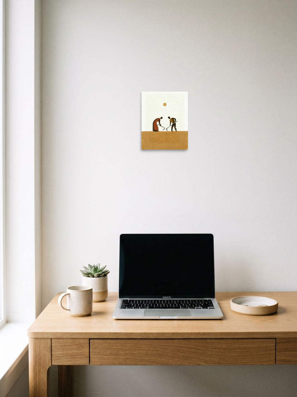 A 8x10 inch unframed paper Minimalism,Modernism print of 'Harvest Rhythm' hanging above a worktable with a laptop.