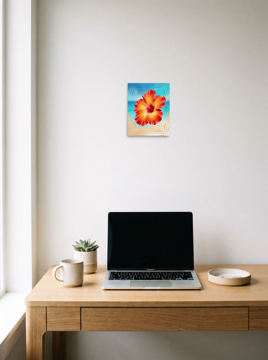 A 8x10 inch unframed paper Realism print of 'Radiant Hibiscus' hanging above a worktable with a laptop.