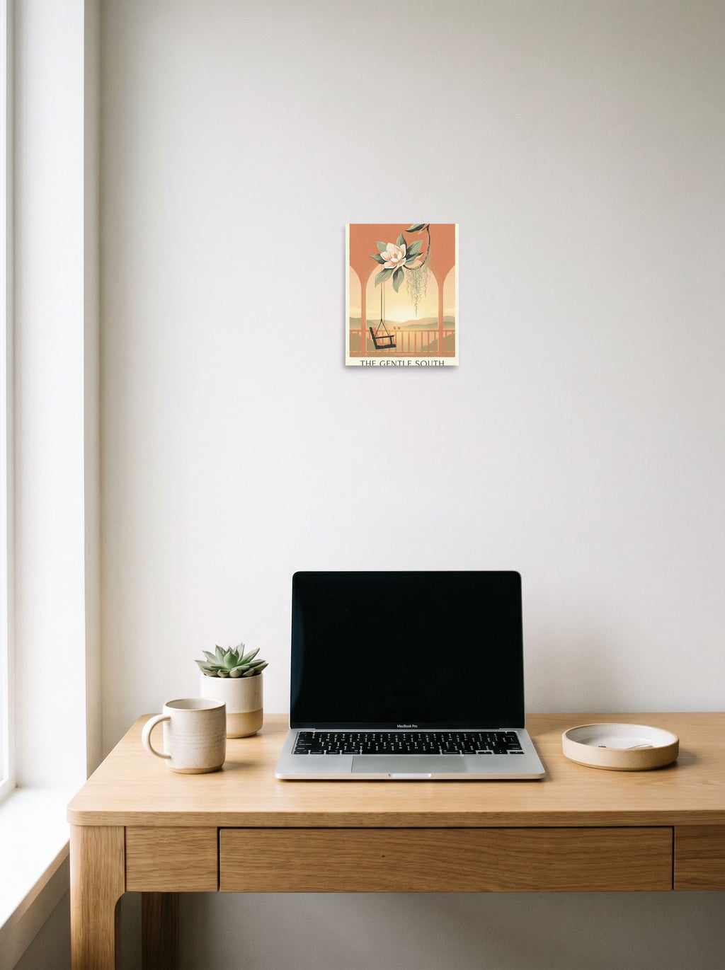A 8x10 inch unframed paper Art Nouveau,Digital art print of 'The Gentle South' hanging above a worktable with a laptop.