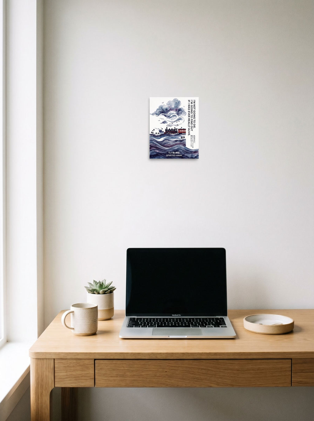A 8x10 inch unframed paper Shin hanga,Japanese art print of 'Journey Through the Clouds' hanging above a worktable with a laptop.
