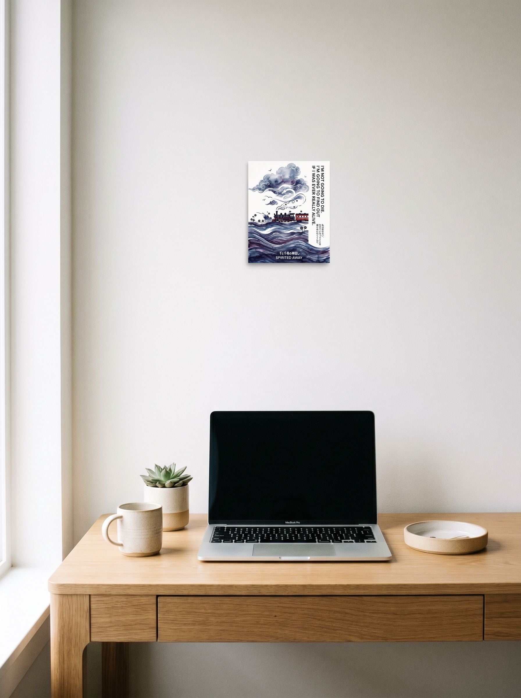 A 8x10 inch unframed paper Shin hanga,Japanese art print of 'Journey Through the Clouds' hanging above a worktable with a laptop.